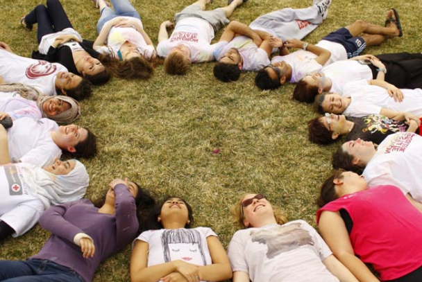 Students from the international program connecting in a circle